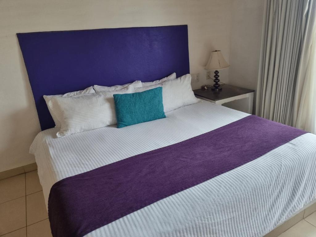 Postel nebo postele na pokoji v ubytování Hotel La Ribereña