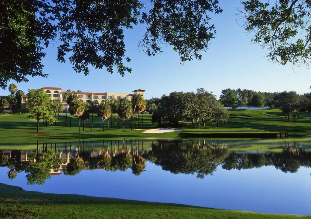 a view of a golf course with a pond at Mission Resort and Club in Howey in the Hills