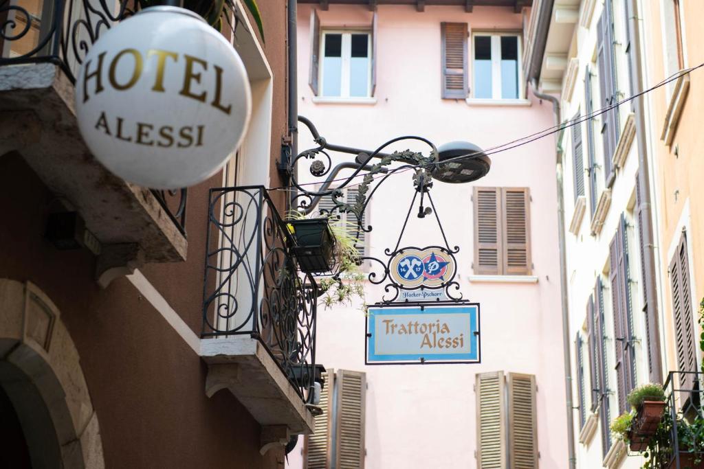 a street with a hotel address sign on the side of a building at Alessi Hotel Trattoria in Desenzano del Garda