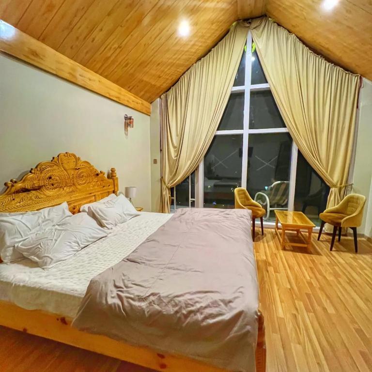 Postel nebo postele na pokoji v ubytování Oasis Resort