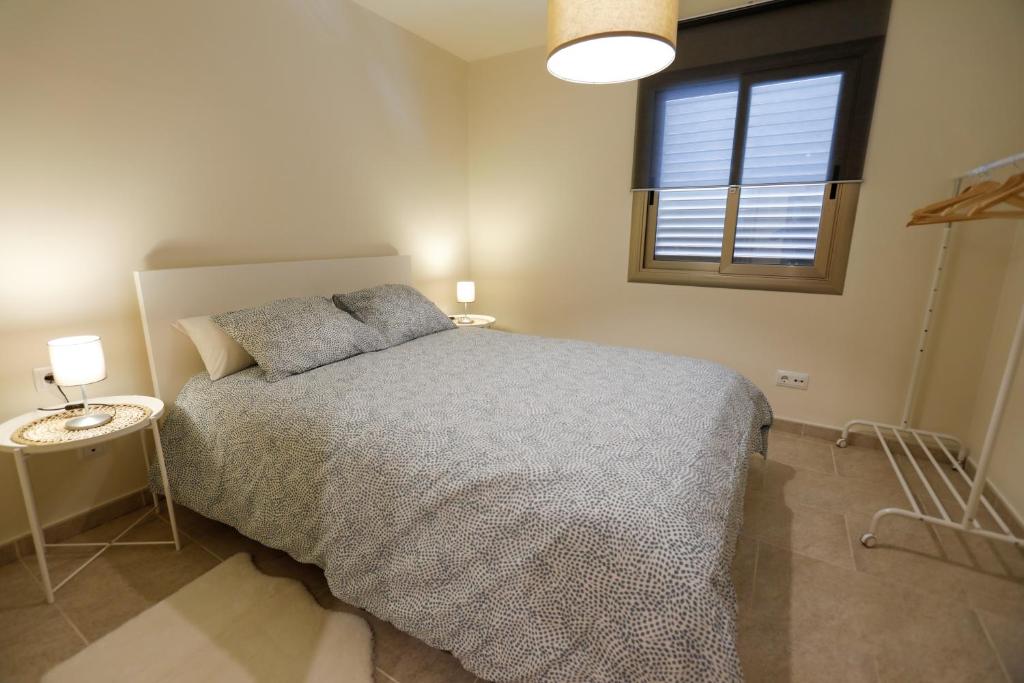 A bed or beds in a room at Mediterranean City