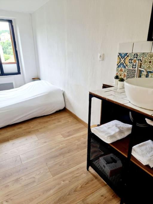 Postel nebo postele na pokoji v ubytování Maisonnette du Foirail