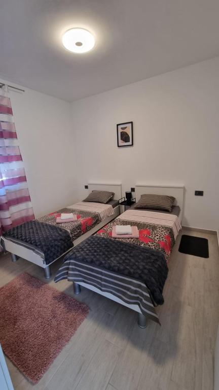 Postel nebo postele na pokoji v ubytování Gabi