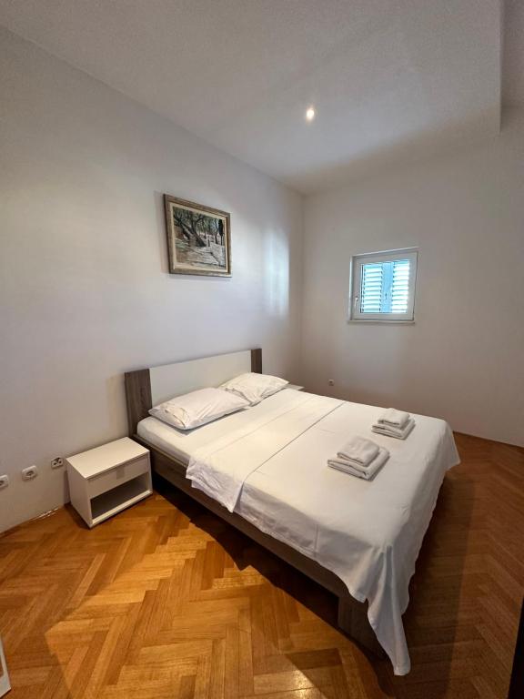Posteľ alebo postele v izbe v ubytovaní Apartments Villa Ohana