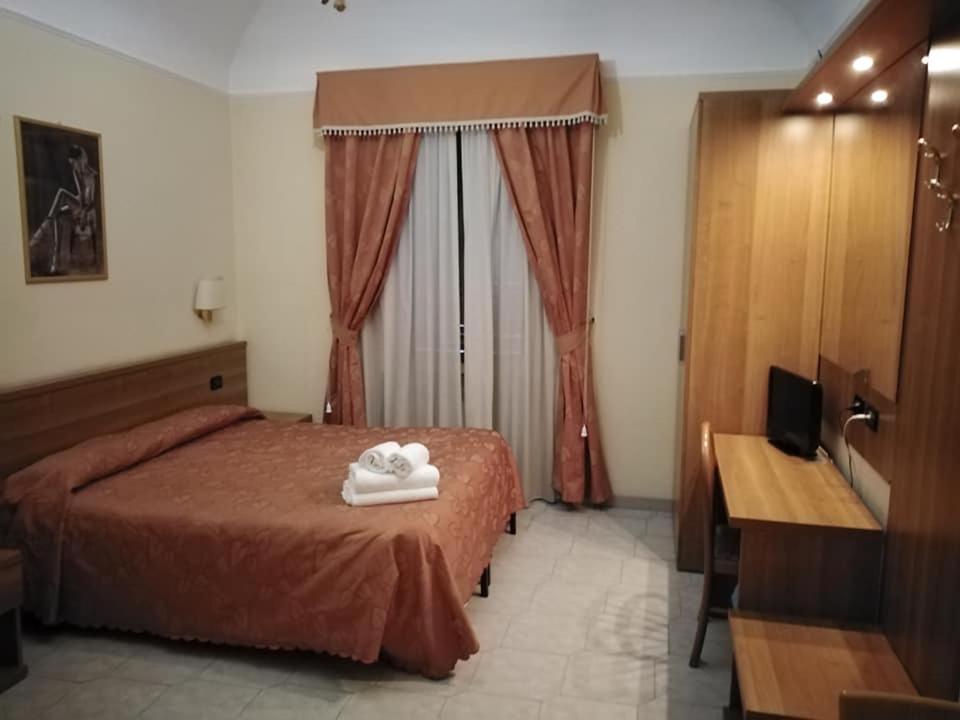 a hotel room with a bed with towels on it at Appartamento Privato Simone in Rome