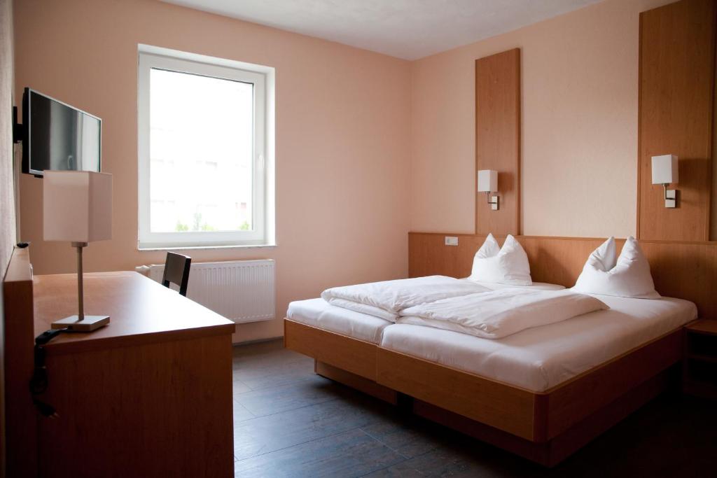 Ένα ή περισσότερα κρεβάτια σε δωμάτιο στο Apartmenthaus Wesertor