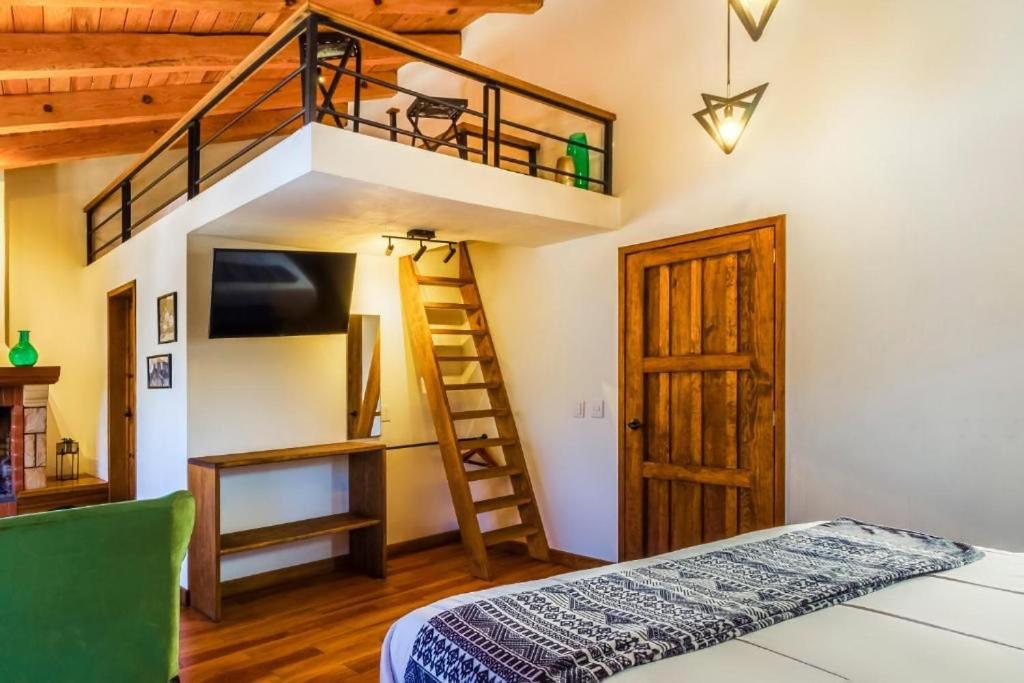 Postel nebo postele na pokoji v ubytování Hotel Kali