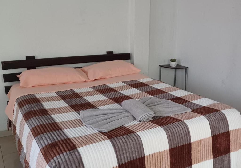 Postel nebo postele na pokoji v ubytování Mindomundo Home