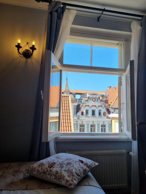 Voodi või voodid majutusasutuse Taanilinna Hotell toas