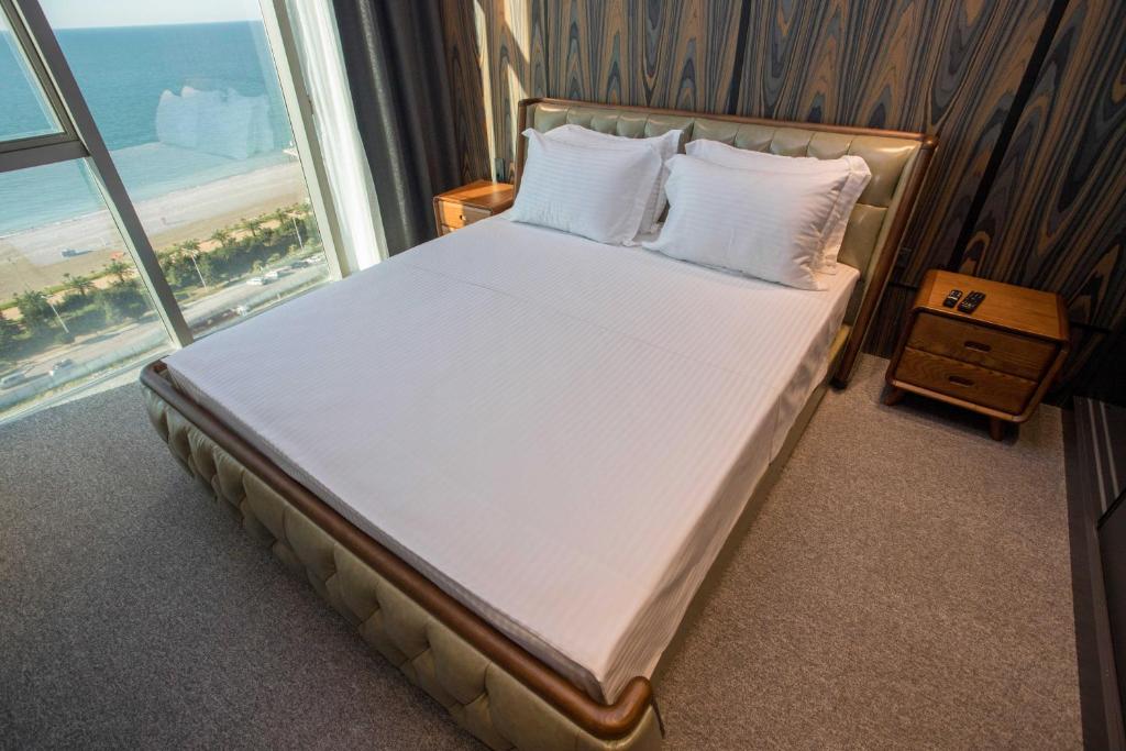 Postel nebo postele na pokoji v ubytování Gumbati Apart Hotel