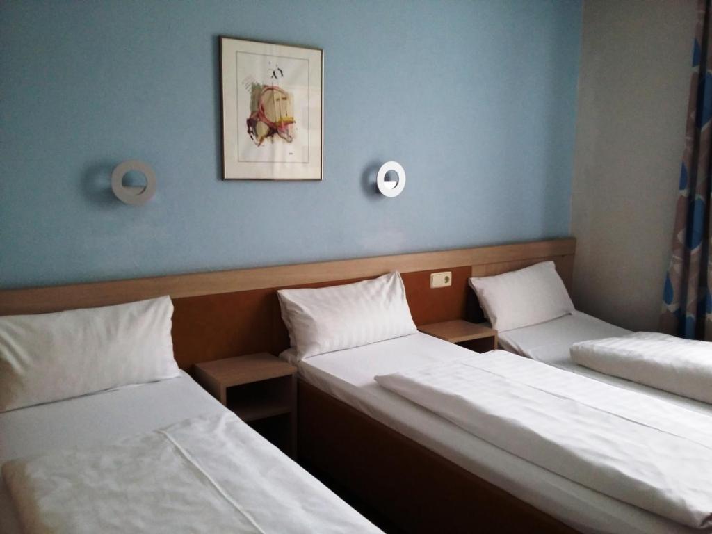 Postel nebo postele na pokoji v ubytování Hotel Imperial