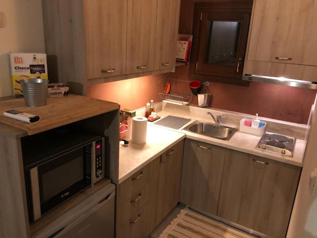 Kuchyň nebo kuchyňský kout v ubytování Aethri Pelion Suites
