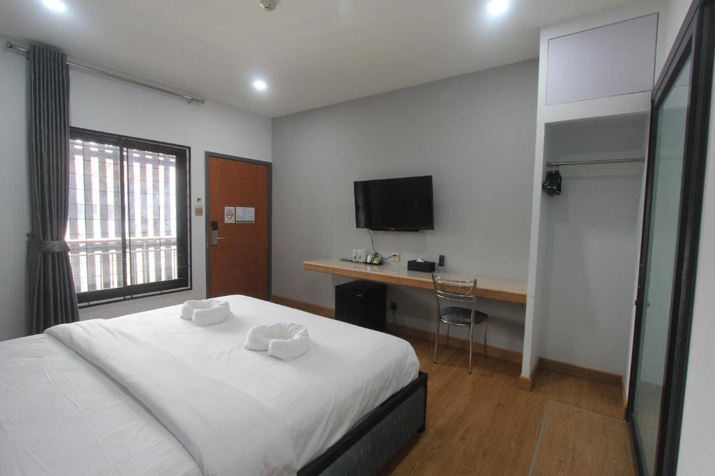 TV a/nebo společenská místnost v ubytování The Mira Hotel Chiang Rai