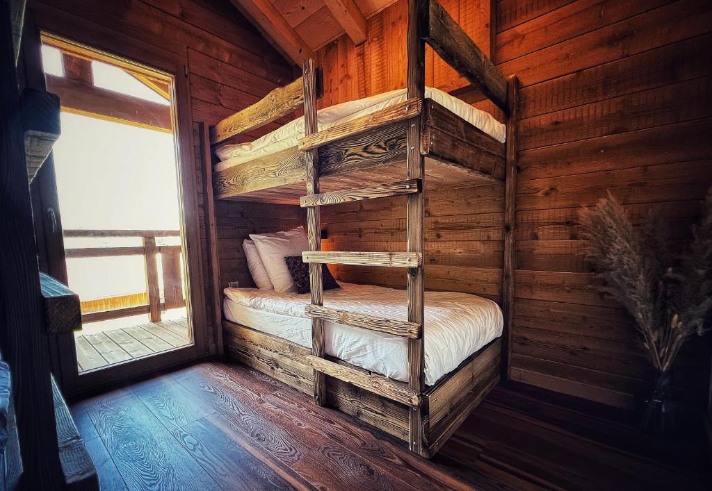 Posteľ alebo postele v izbe v ubytovaní Chalet Aconit, terrasse panoramique avec jacuzzi et sauna