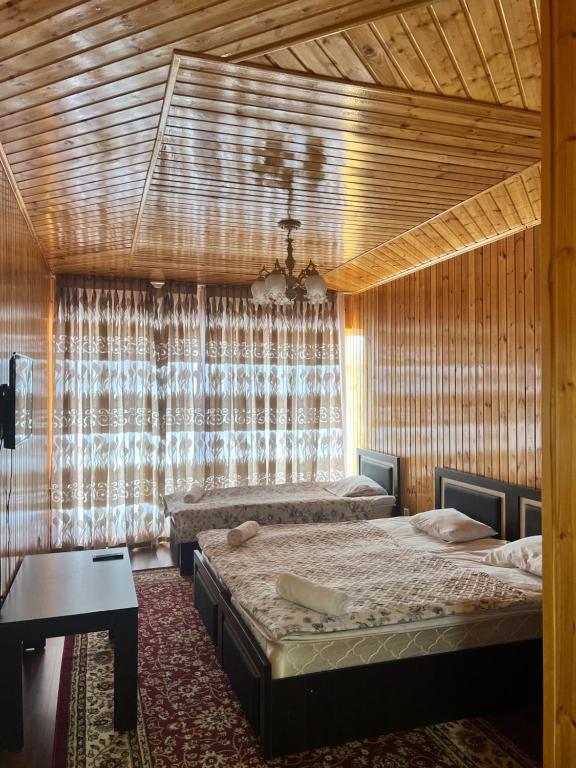 Katil atau katil-katil dalam bilik di Отель Евразия