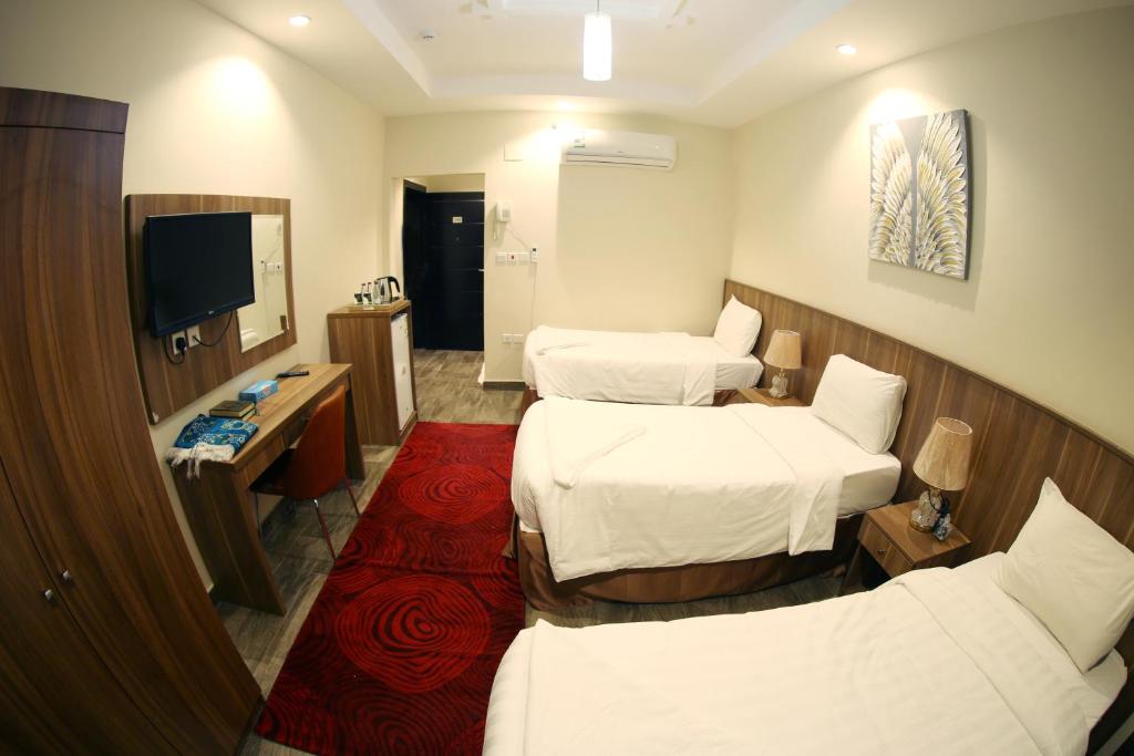 TV a/nebo společenská místnost v ubytování فندق المربع السابع Seventh Square Hotel