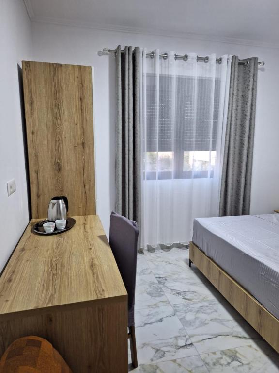 Postel nebo postele na pokoji v ubytování Vila Gashi