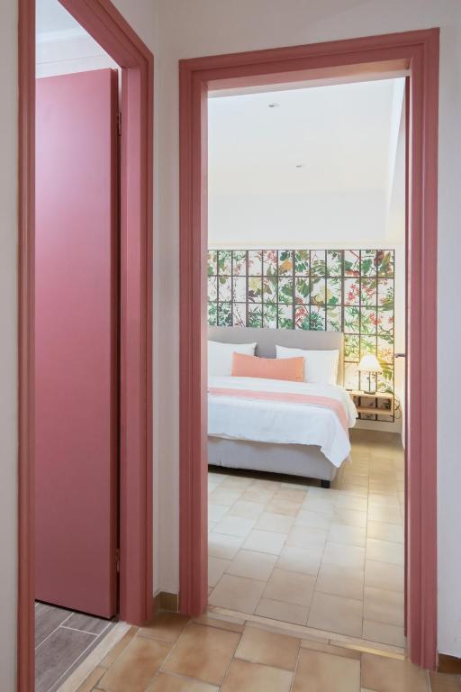 Postel nebo postele na pokoji v ubytování Monemvasia Green Apartments