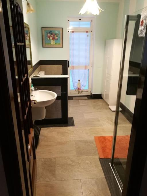 a bathroom with a sink and a toilet at Taoretto 1 in Serravalle delle Langhe