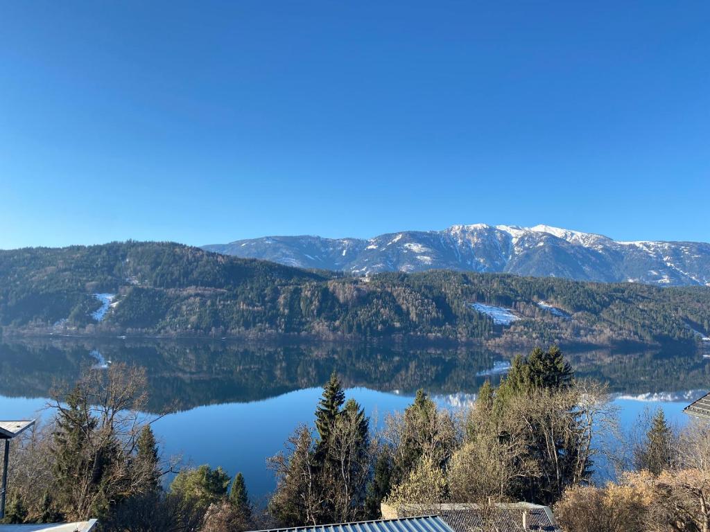 a view of a lake in the mountains at See- & Bergblick Millstatt in Millstatt