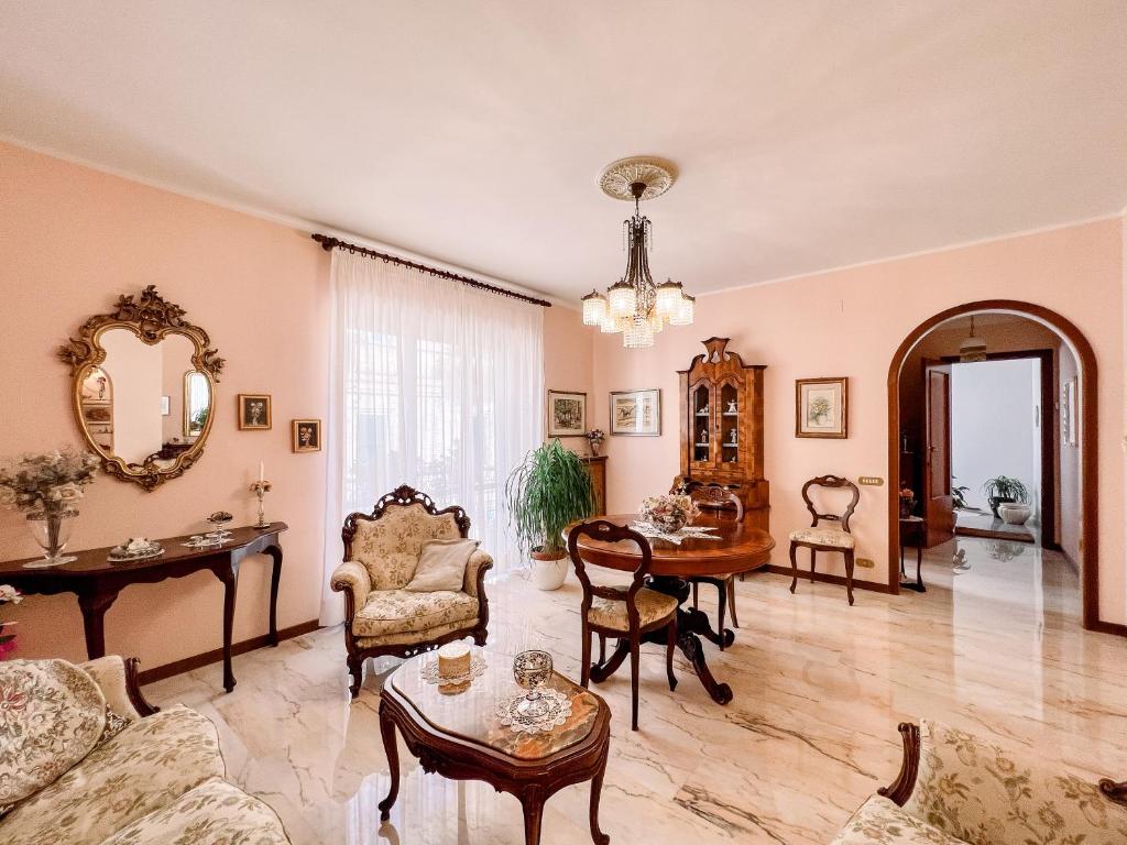 a living room filled with furniture and a table at Borgo Antico in Atessa
