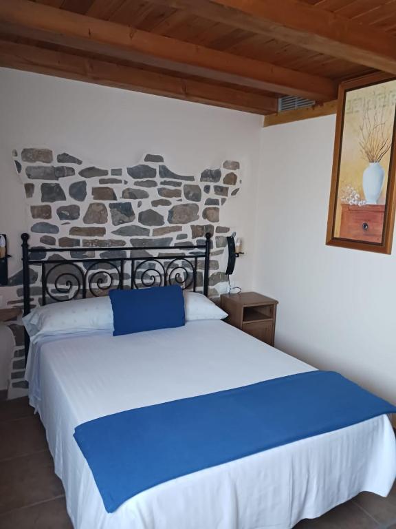Postel nebo postele na pokoji v ubytování Casa Arruebo