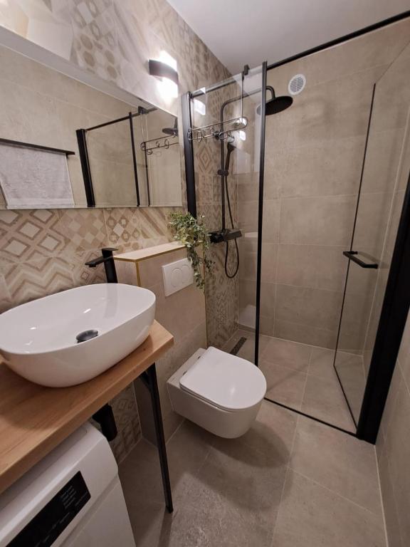 Koupelna v ubytování Studio Apartments Leut & Lanterna