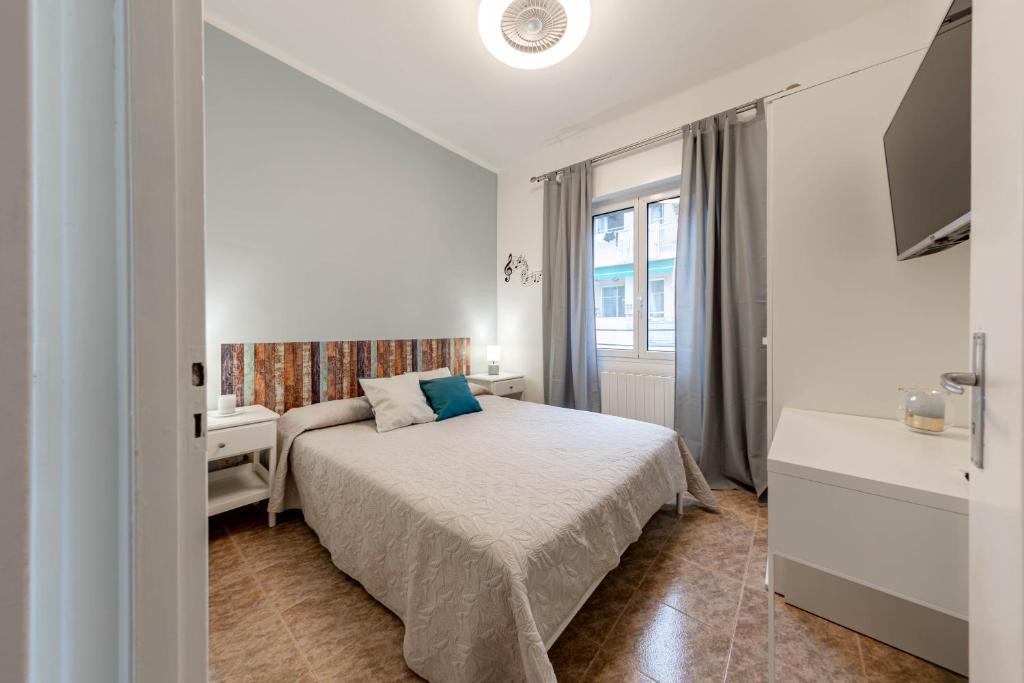 Posteľ alebo postele v izbe v ubytovaní H11 ARISTON CENTRO Sanremo - Mare