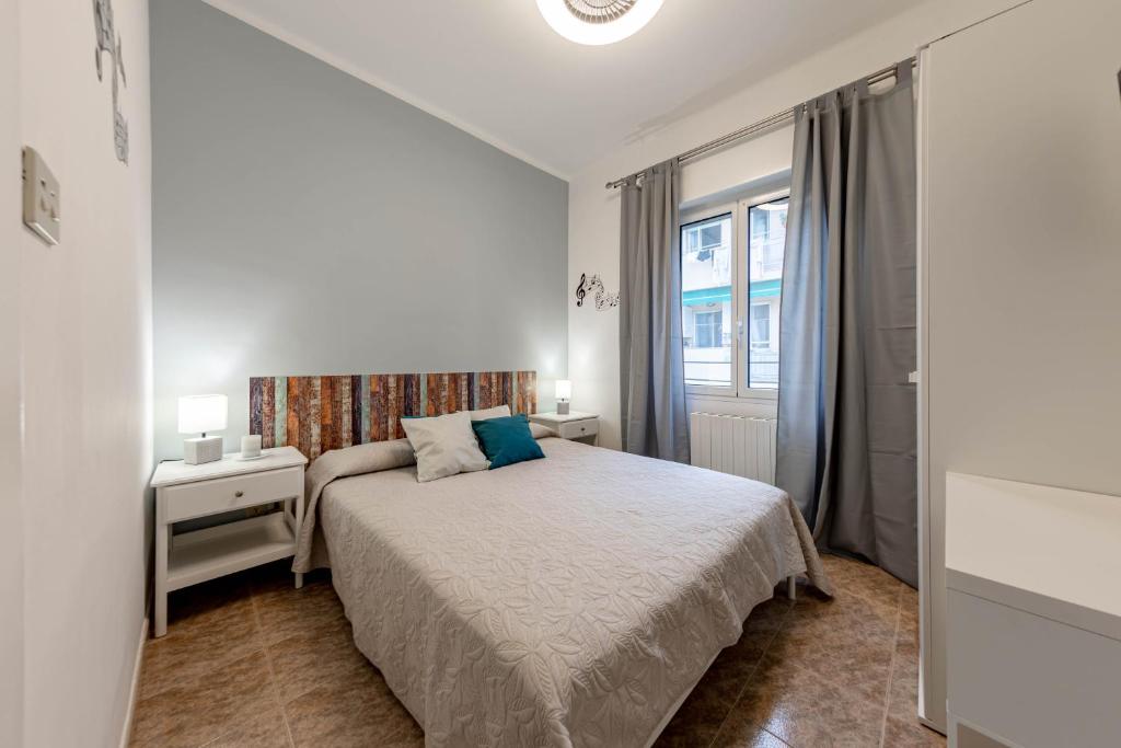 Posteľ alebo postele v izbe v ubytovaní H11 ARISTON CENTRO Sanremo - Mare