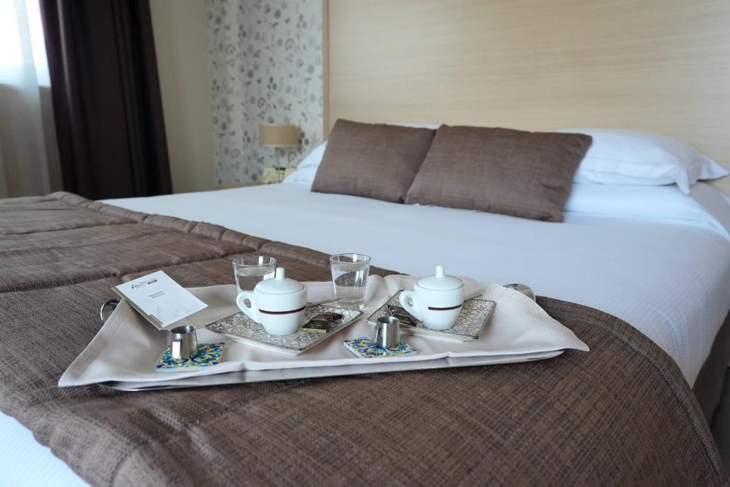 Voodi või voodid majutusasutuse Hotel Torre Del Sud toas