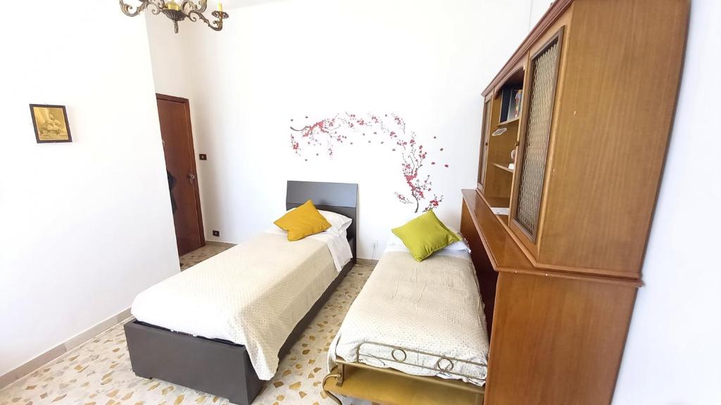 Postel nebo postele na pokoji v ubytování OPERA21 TUSCANY SINGLE HOUSE LUCIGNANO