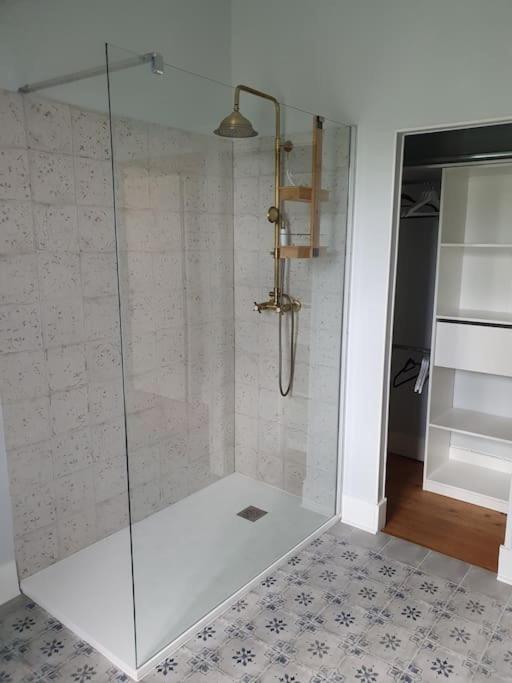 a shower with a glass door in a bathroom at Cosy Billy - Appartement de charme in Billy