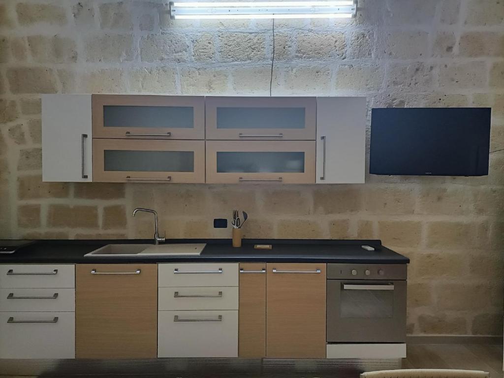 Kuchyň nebo kuchyňský kout v ubytování Florooms Dimora in stile Rustico-Moderno