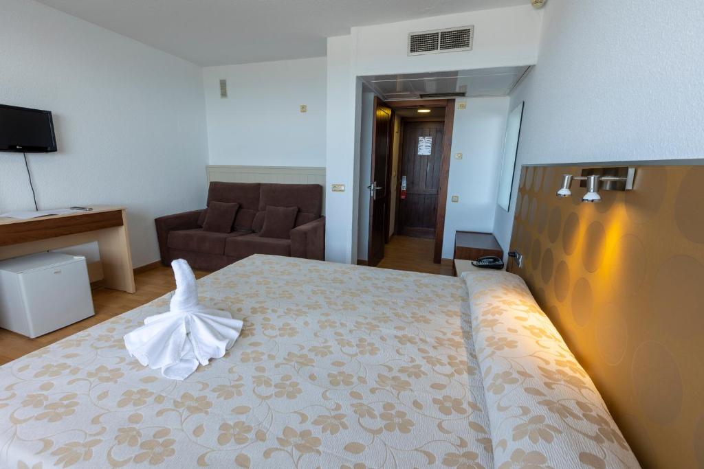 Postel nebo postele na pokoji v ubytování Hotel Flamero