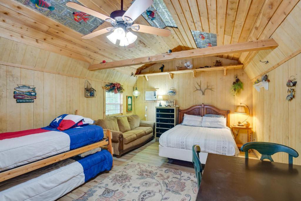 a bedroom with two beds and a ceiling fan at Emory Studio Cabin with Lake Fork Boat Access! in Emory