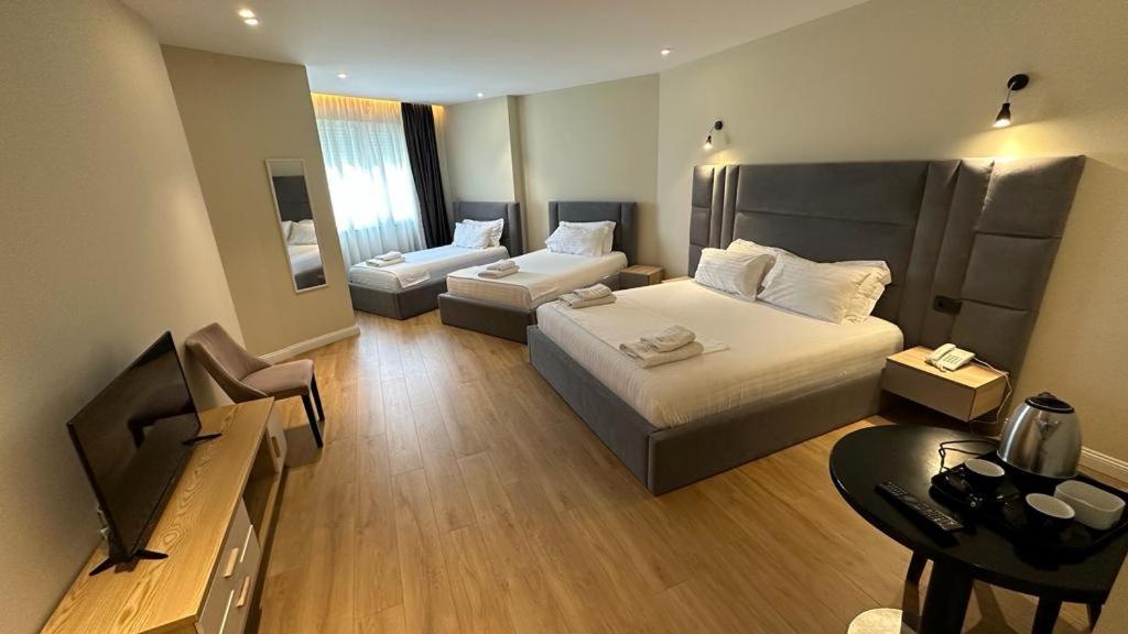 Llit o llits en una habitació de Granda Hotel