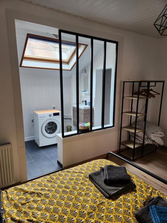 Posteľ alebo postele v izbe v ubytovaní Appartement proche des remparts