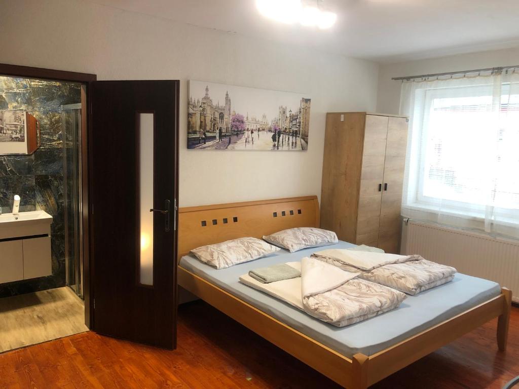 Кровать или кровати в номере Studio agnieszka 1