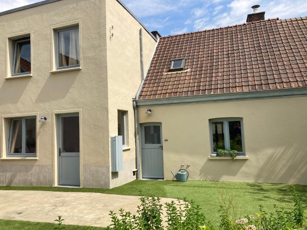 a white house with a brown roof at 't Jaar 50 in Wortegem