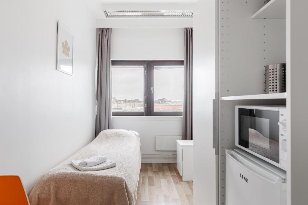 Postel nebo postele na pokoji v ubytování Sky Hostel Helsinki