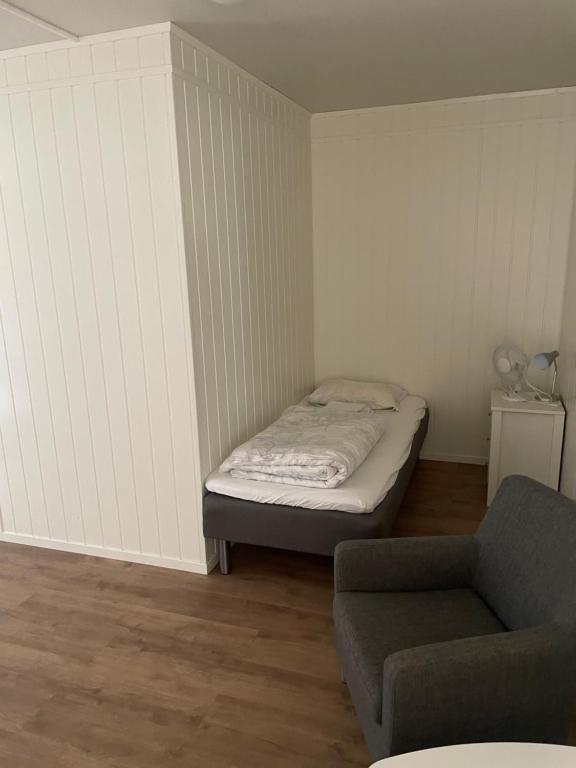 Postel nebo postele na pokoji v ubytování Harran Gjestehus