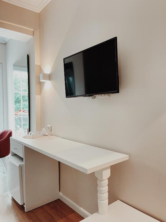 TV a/nebo společenská místnost v ubytování Ruby Palace