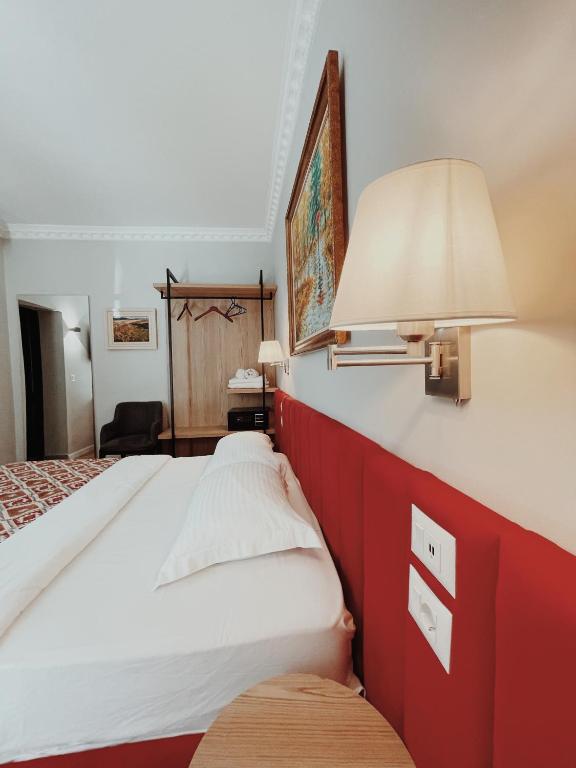 Postel nebo postele na pokoji v ubytování Ruby Palace