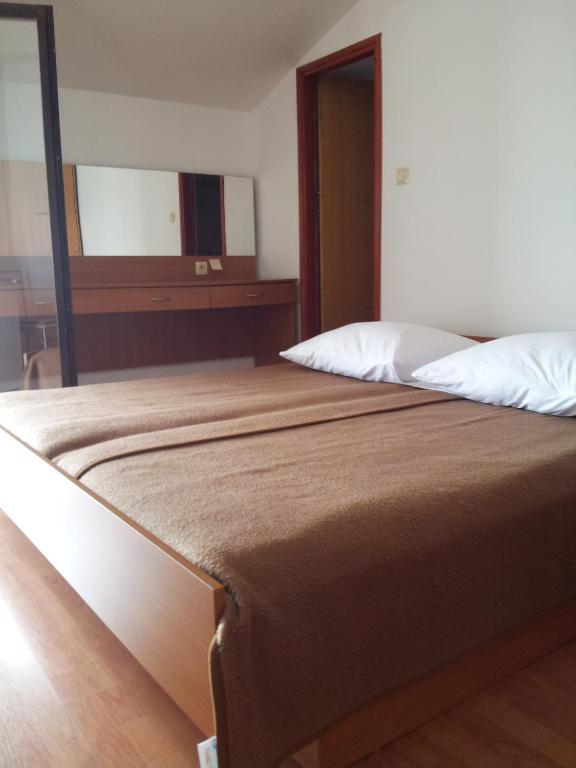 Postel nebo postele na pokoji v ubytování Guest House Vukušić