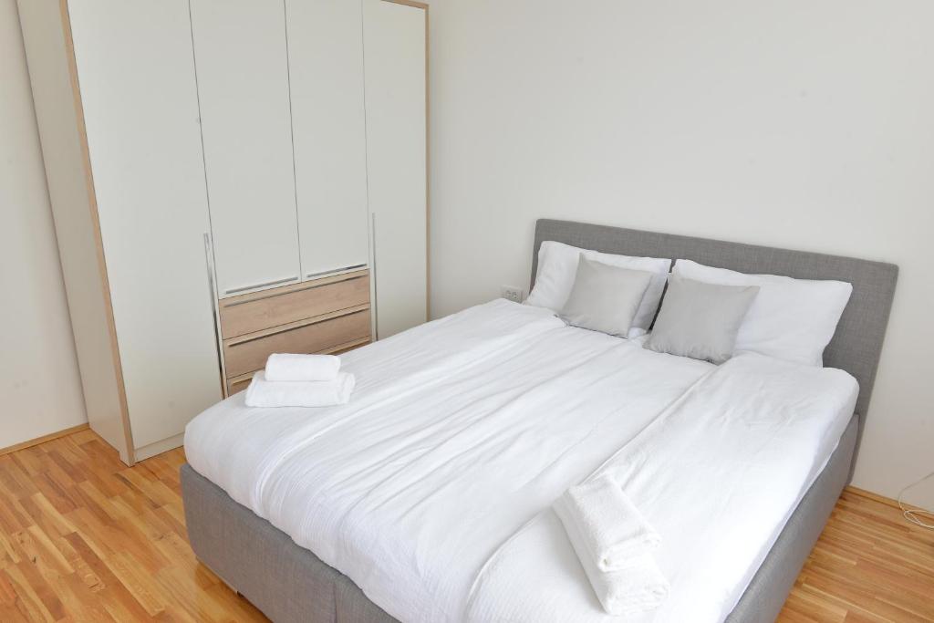Postel nebo postele na pokoji v ubytování HM Apartments