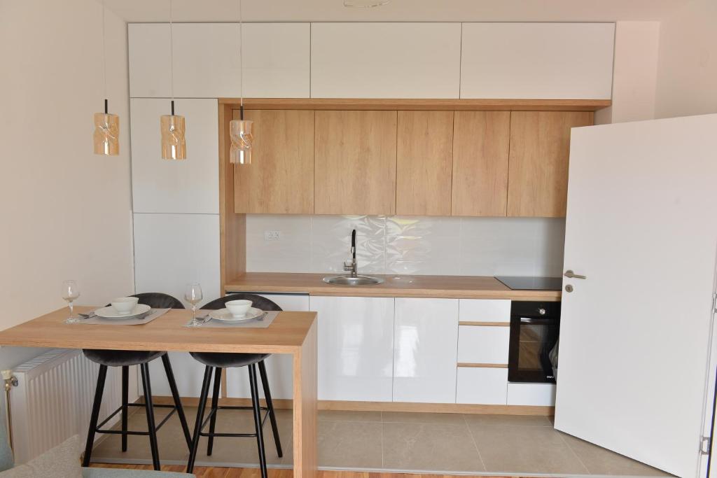 Kuchyň nebo kuchyňský kout v ubytování HM Apartments