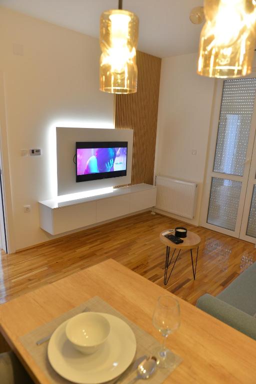 TV a/nebo společenská místnost v ubytování HM Apartments