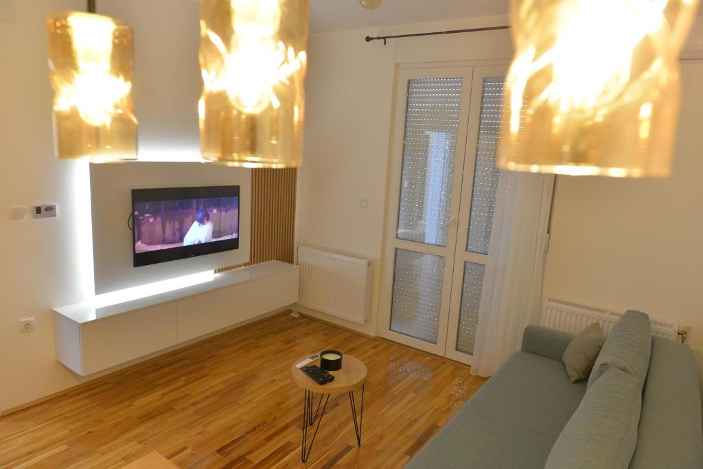TV a/nebo společenská místnost v ubytování HM Apartments