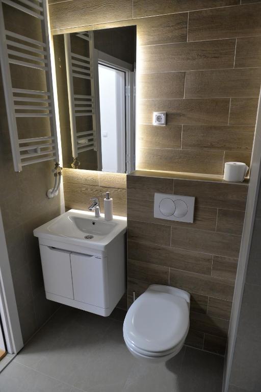 Koupelna v ubytování HM Apartments