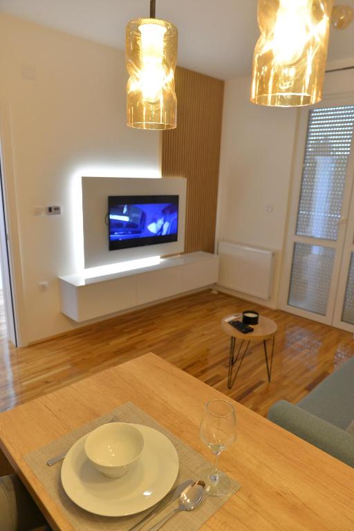 TV a/nebo společenská místnost v ubytování HM Apartments